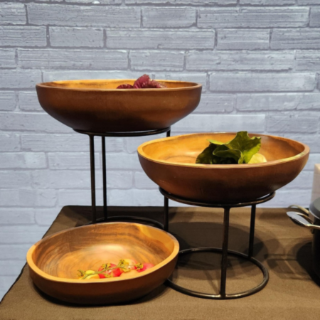black round tall risers with wooden bowls